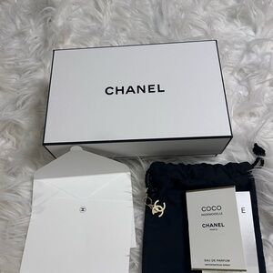 CHANEL empty box with small pouch with charm . Perfume samples .